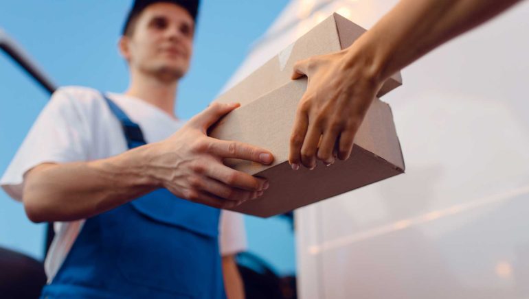 deliveryman-gives-parcel-to-female-recipient-HH3Z3T7.jpg deliveryman-gives-parcel-to-female-recipient-HH3Z3T7.jpg